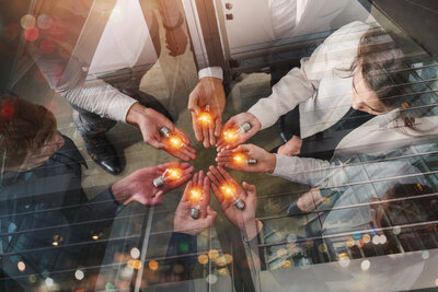 teamwork-brainstorming-concept-with-businessmen-that-share-idea-with-lamp